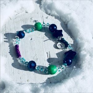 Peacock colored beaded,T initial charm bracelet